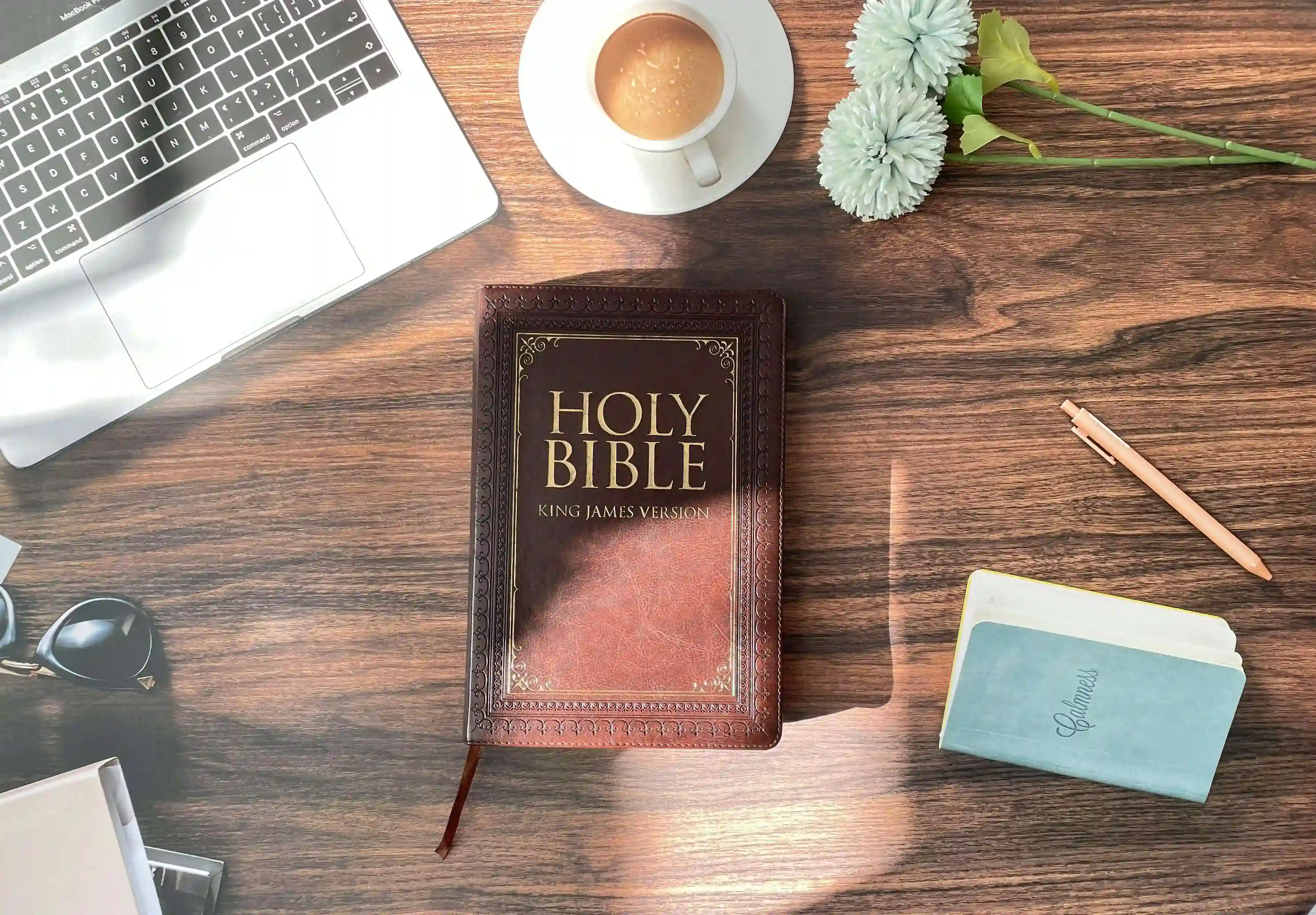 Holy Bible open on desk for Christian study and AI-powered faith exploration